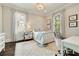Cozy bedroom with natural light, complemented by neutral decor, and a stylish area rug at 1201 Beech Valley Ne Rd, Atlanta, GA 30306
