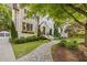 Charming home with stone pathway, manicured bushes, garden, and window boxes leading to the inviting front door at 1201 Beech Valley Ne Rd, Atlanta, GA 30306