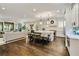 Bright kitchen with a large island, stainless steel appliances, and hardwood floors open to the living room at 1201 Beech Valley Ne Rd, Atlanta, GA 30306