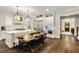 Gourmet kitchen features white cabinets, stainless steel appliances, an eat-in island and hardwood floors at 1201 Beech Valley Ne Rd, Atlanta, GA 30306