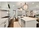 Modern kitchen with stainless appliances, island, and beautiful marble countertops at 1201 Beech Valley Ne Rd, Atlanta, GA 30306