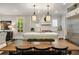 A kitchen island with light granite countertops, stainless steel appliances and dark hardwood floors at 1201 Beech Valley Ne Rd, Atlanta, GA 30306