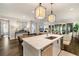 Kitchen island with a light countertop and eat in table is open to the living room at 1201 Beech Valley Ne Rd, Atlanta, GA 30306