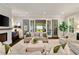 Inviting living room featuring a fireplace, neutral furnishings, and access to the outdoors at 1201 Beech Valley Ne Rd, Atlanta, GA 30306