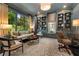 Elegant living room with built-in bookshelves, large window, and comfortable seating arrangement and designer touches at 1201 Beech Valley Ne Rd, Atlanta, GA 30306