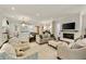 Spacious living room with a fireplace, neutral-colored seating, and view into the kitchen at 1201 Beech Valley Ne Rd, Atlanta, GA 30306