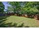 Expansive backyard with well-maintained lawn and privacy fence, perfect for outdoor activities at 1314 Arkwright Se Pl, Atlanta, GA 30317