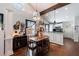 Cozy dining area with wooden table, decorative lighting, and open access to the kitchen at 1314 Arkwright Se Pl, Atlanta, GA 30317