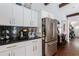 Well-equipped kitchen boasts ample counter space, stainless steel refrigerator, and modern finishes at 1314 Arkwright Se Pl, Atlanta, GA 30317
