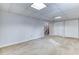 Large basement area showing stairs, closets, neutral paint and carpet at 1355 Compton Woods Dr, Loganville, GA 30052