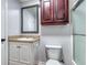 Bathroom featuring vanity with sink, mirror, and a toilet at 1355 Compton Woods Dr, Loganville, GA 30052