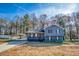Charming two-story home with a carport and a well-maintained front yard at 1355 Compton Woods Dr, Loganville, GA 30052