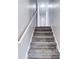 Carpeted stairway with white walls leading to the second floor at 1355 Compton Woods Dr, Loganville, GA 30052