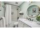 Stylish bathroom with a shower-tub combo, marble countertop, and gold fixtures at 2129 Arlington Ne Ave, Atlanta, GA 30324
