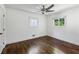 Bright and airy bedroom with hardwood floors and a ceiling fan at 2129 Arlington Ne Ave, Atlanta, GA 30324
