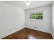 Empty bedroom with hardwood floors and one window at 2129 Arlington Ne Ave, Atlanta, GA 30324