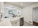 Bright kitchen with a farmhouse sink, stainless steel dishwasher, and open layout at 2129 Arlington Ne Ave, Atlanta, GA 30324
