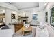 Inviting living room featuring hardwood floors, a fireplace, and large windows at 2129 Arlington Ne Ave, Atlanta, GA 30324