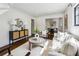 Inviting living room featuring hardwood floors, recessed lighting, and neutral furniture flowing into dining area at 2129 Arlington Ne Ave, Atlanta, GA 30324