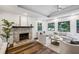 Comfortable living room with a brick fireplace, hardwood floors, and natural light at 2129 Arlington Ne Ave, Atlanta, GA 30324