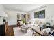 Bright living room featuring hardwood floors, recessed lighting, and neutral furniture, flowing into dining area at 2129 Arlington Ne Ave, Atlanta, GA 30324