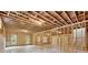 Unfinished basement featuring exposed wood frame and ceiling, ready for customization at 2977 N Bogan Rd, Buford, GA 30519