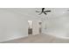 Bright bedroom with hardwood floors, recessed lighting, and two entryways to a closet and bathroom at 2977 N Bogan Rd, Buford, GA 30519