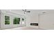 Large bedroom featuring recessed lights, fireplace and big windows at 2977 N Bogan Rd, Buford, GA 30519