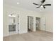 Bedroom featuring hardwood floors, and access to a bathroom and walk-in closet at 2977 N Bogan Rd, Buford, GA 30519