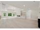 Bright living area featuring large windows, a fireplace, and stylish built-in shelving at 2977 N Bogan Rd, Buford, GA 30519