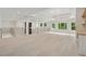 Open loft area with a modern staircase and plenty of natural light from large windows at 2977 N Bogan Rd, Buford, GA 30519