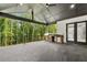 Covered patio with a built-in outdoor kitchen featuring a grill and countertop space at 2977 N Bogan Rd, Buford, GA 30519