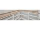 Custom built-in shelving offering ample storage and organization space, with a light wood finish for a warm touch at 2977 N Bogan Rd, Buford, GA 30519