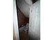 Small bathroom featuring a toilet, door, and limited space at 4752 Browns Mill Ferry Rd, Lithonia, GA 30038