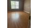 Bedroom with vinyl flooring and ample natural light at 4752 Browns Mill Ferry Rd, Lithonia, GA 30038
