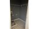 Small walk-in closet with wire shelving, grey walls and tile floors at 4752 Browns Mill Ferry Rd, Lithonia, GA 30038