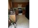 Kitchen area with cabinetry, appliances, and tile flooring at 4752 Browns Mill Ferry Rd, Lithonia, GA 30038