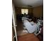 An untidy room featuring a couch, a ceiling fan, and multiple boxes at 4752 Browns Mill Ferry Rd, Lithonia, GA 30038