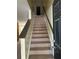 Carpeted staircase leading to the upper level of the home at 4752 Browns Mill Ferry Rd, Lithonia, GA 30038