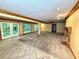Large finished basement area with ample natural light and a cozy fireplace at 5346 Light Cir, Norcross, GA 30071
