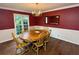 Elegant dining room with hardwood floors, a chandelier, and large windows at 5346 Light Cir, Norcross, GA 30071