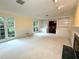 Bright living room with large windows, built-in shelving, and a fireplace at 5346 Light Cir, Norcross, GA 30071