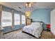 Comfortable bedroom with carpet, great natural light, and a ceiling fan for added comfort at 10900 Wittenridge Dr # L6, Alpharetta, GA 30022