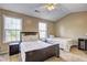 Bright bedroom featuring two twin beds, neutral walls, and natural light from two windows at 10900 Wittenridge Dr # L6, Alpharetta, GA 30022