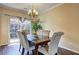 Bright dining area featuring sliding glass doors to the patio and comfortable seating for memorable meals at 10900 Wittenridge Dr # L6, Alpharetta, GA 30022