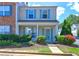 Charming two-story home featuring a welcoming front porch, tidy landscaping, and attractive curb appeal with blue shutters at 10900 Wittenridge Dr # L6, Alpharetta, GA 30022