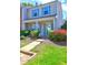 Attractive two-story home with a welcoming front porch, and tidy landscaping, complemented by blue shutters at 10900 Wittenridge Dr # L6, Alpharetta, GA 30022