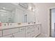 Bright bathroom with double sink vanity, modern lighting, and a luxurious glass shower at 1149 Ansel Nw Ln, Atlanta, GA 30318