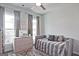 Bedroom featuring a plush daybed, neutral decor, and lots of natural light at 1149 Ansel Nw Ln, Atlanta, GA 30318