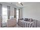 A soothing bedroom with a daybed, fluffy rug, and natural light from two windows at 1149 Ansel Nw Ln, Atlanta, GA 30318